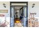 Welcoming entryway leading to an open-concept living room with hardwood floors at 313 Dingler Rd, Moreland, GA 30259