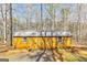 Wooden outbuilding features a gray metal roof and double doors at 313 Dingler Rd, Moreland, GA 30259