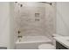 Bathroom features shower-tub combo with tile surround and gold fixtures at 434 Selborne Way, Chattahoochee Hills, GA 30268