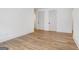 Hardwood flooring complements neutral walls and baseboards in this bedroom at 434 Selborne Way, Chattahoochee Hills, GA 30268