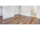 Open bedroom showcases an ensuite bath and a view into another room at 434 Selborne Way, Chattahoochee Hills, GA 30268