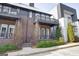 Charming townhome with a brick facade, private balconies, and landscaped front yard at 434 Selborne Way, Chattahoochee Hills, GA 30268