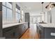 Well-lit kitchen with stainless steel appliances, a marble countertop, and hardwood floors at 434 Selborne Way, Chattahoochee Hills, GA 30268