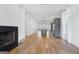 Spacious living room with fireplace, hardwood floors, and an open layout at 434 Selborne Way, Chattahoochee Hills, GA 30268