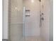 Modern shower with white subway tile, a glass enclosure, and built-in niche storage at 434 Selborne Way, Chattahoochee Hills, GA 30268
