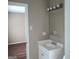 Neutral bathroom features a sink with bright lighting and tile flooring at 6521 King William Dr, Morrow, GA 30260
