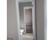 Neutral bathroom features tile floors and an open doorway to a bedroom at 6521 King William Dr, Morrow, GA 30260