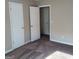 Bedroom features neutral color scheme, plush carpeting, and painted walls at 6521 King William Dr, Morrow, GA 30260