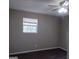 Bedroom featuring a ceiling fan, window and neutral paint color scheme at 6521 King William Dr, Morrow, GA 30260
