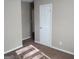Neutral bedroom features plush carpeting and a painted, neutral color scheme at 6521 King William Dr, Morrow, GA 30260