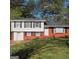 Charming two-story home with a well-maintained lawn and traditional architecture at 6521 King William Dr, Morrow, GA 30260