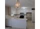 Open kitchen featuring lots of counter space, white cabinets, and tile floors at 6521 King William Dr, Morrow, GA 30260