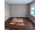 A well-lit living room featuring hardwood floors and neutral wall colors at 6521 King William Dr, Morrow, GA 30260