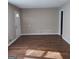 Bright living room with hardwood floors, painted in neutral colors, and a front entrance at 6521 King William Dr, Morrow, GA 30260