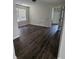 Bright bedroom with modern hard wood flooring and large window at 1857 Oak Hill Springs Blvd, Lithonia, GA 30058