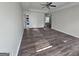 Large bedroom featuring wood-look flooring, a ceiling fan, and recessed ceiling details at 1857 Oak Hill Springs Blvd, Lithonia, GA 30058
