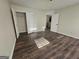View of a bright bedroom with wood floors and a closet at 1857 Oak Hill Springs Blvd, Lithonia, GA 30058