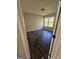 Bedroom with a window, wood flooring, light fixture and neutral paint at 1857 Oak Hill Springs Blvd, Lithonia, GA 30058