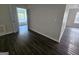 Bedroom featuring natural light, hardwood floors, and neutral walls at 1857 Oak Hill Springs Blvd, Lithonia, GA 30058