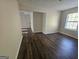 Bedroom featuring natural light, hardwood floors, and neutral walls at 1857 Oak Hill Springs Blvd, Lithonia, GA 30058