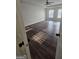 Bedroom featuring wood-look flooring, a ceiling fan, and windows with natural light at 1857 Oak Hill Springs Blvd, Lithonia, GA 30058