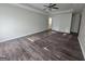 Spacious bedroom boasts hardwood floors and ceiling fan at 1857 Oak Hill Springs Blvd, Lithonia, GA 30058