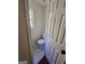 Compact powder room with tile flooring, a toilet, and a window for natural light at 1857 Oak Hill Springs Blvd, Lithonia, GA 30058