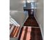 Hardwood staircase from above showcasing the bright entrance and natural light at 1857 Oak Hill Springs Blvd, Lithonia, GA 30058