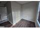 A large walk-in closet with hardwood flooring, a window, and wire shelving at 1857 Oak Hill Springs Blvd, Lithonia, GA 30058