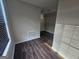 An empty walk-in closet with hardwood flooring, wire shelving, and natural light at 1857 Oak Hill Springs Blvd, Lithonia, GA 30058