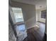 A walk-in closet with hardwood flooring, a window, and wire shelving at 1857 Oak Hill Springs Blvd, Lithonia, GA 30058