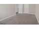 Bedroom featuring neutral carpet, white trim, and two doors at 60 Charlotte Blvd, Stockbridge, GA 30281
