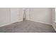 Bedroom featuring neutral carpet, white trim, and a closet at 60 Charlotte Blvd, Stockbridge, GA 30281