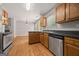 Kitchen with stainless steel dishwasher, wooden cabinets, and sleek countertops at 60 Charlotte Blvd, Stockbridge, GA 30281