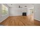 Bright living room featuring hardwood floors, a fireplace, and windows offering plenty of natural light at 60 Charlotte Blvd, Stockbridge, GA 30281