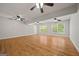 Spacious living room featuring hardwood floors, ceiling fans, and natural light at 60 Charlotte Blvd, Stockbridge, GA 30281