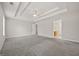 Expansive main bedroom with soft gray walls, plush carpet, and an en-suite bathroom at 60 Charlotte Blvd, Stockbridge, GA 30281