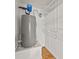 The water heater and shelving are visible in the utility room with hardwood floors at 60 Charlotte Blvd, Stockbridge, GA 30281