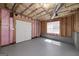 Unfinished basement featuring exposed beams and insulation providing a blank canvas for customization at 249 Edenwylde Ct, Hampton, GA 30228