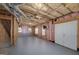 Exposed basement with studded walls, insulated ceilings, and windows at 249 Edenwylde Ct, Hampton, GA 30228