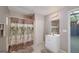Bathroom with tropical shower curtain and single vanity at 249 Edenwylde Ct, Hampton, GA 30228