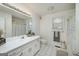 Bright bathroom featuring a single vanity and a window with blind at 249 Edenwylde Ct, Hampton, GA 30228