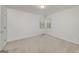 Bright bedroom featuring neutral carpet and large windows at 249 Edenwylde Ct, Hampton, GA 30228