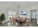 Staged dining room with luxury vinyl flooring and chandelier at 249 Edenwylde Ct, Hampton, GA 30228