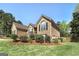 Charming brick home showcasing mature landscaping, well-maintained lawn, and a classic architectural design at 249 Edenwylde Ct, Hampton, GA 30228