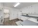 Spacious kitchen with vintage appliances, adjoining laundry room, and backyard access at 249 Edenwylde Ct, Hampton, GA 30228
