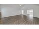 Spacious open living room featuring luxury vinyl flooring at 249 Edenwylde Ct, Hampton, GA 30228