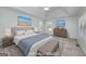 Spacious staged main bedroom offers a tray ceiling, carpeted floors, and sun-filled windows at 249 Edenwylde Ct, Hampton, GA 30228