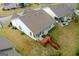 Aerial view of the home's backyard featuring a spacious deck and screened in patio at 161 Spring Creek Blvd, Mcdonough, GA 30253