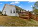 A beautiful backyard featuring a spacious wood deck and a well-maintained lawn that surrounds the house at 161 Spring Creek Blvd, Mcdonough, GA 30253